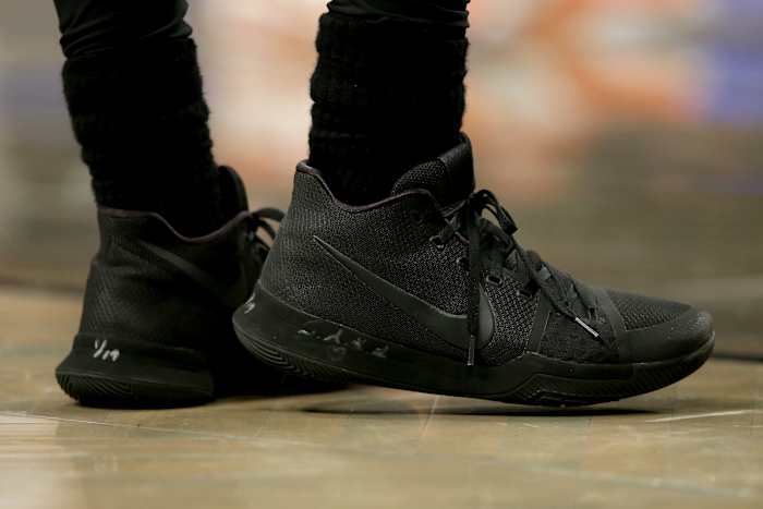 View of black Nike Kyrie shoes.